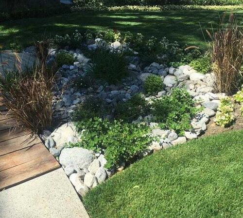 Stone landscaping in Backyard